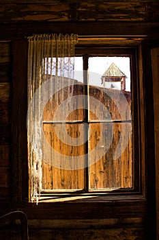 Looking Out a Rustic Wooden Western Window Frame