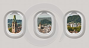Looking out the windows of a plane to the city of Zurich
