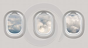 Looking out the windows of a plane to a clouds