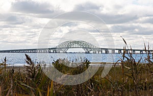 Looking over beach grass and reed at the Great South Bay Bridges from Gardiners PArk