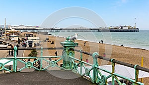 Looking over the promenade railings towards the Palace Pier in Brighton, UK photo