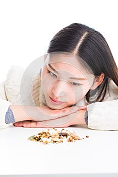 Looking at a pile of Chinese herbs.