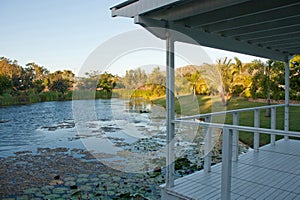 Looking at a pond from a white garden house / gazebo / arbour in Queensland, Australia