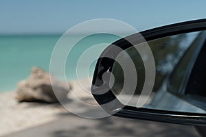 Looking at rear mirror while driving along the Casey Key Beach