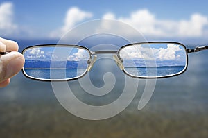 Looking at the sea through the glasses