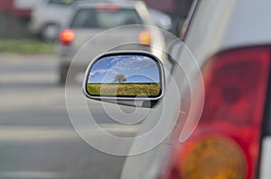 Looking in the side rear-view mirror
