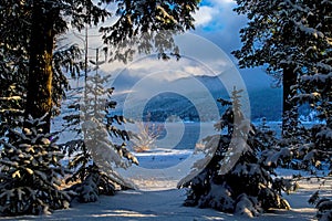 Looking Through The Snowy Landscape To The Lake