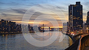 Looking southward along the East River toward the 59th Street bridge on Manhattan`s Upper East side during sunset