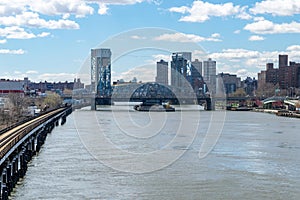 Looking southward along the Harlem River at the Madison Avenue Bridge in Harlem, NYC, USA