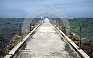 Looking straight out at the Port Everglades Inlet Fishing Jetty on the beach in Fort Lauderdale