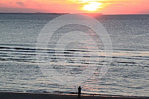 Looking at sunset, Island of Ameland, Holland photo