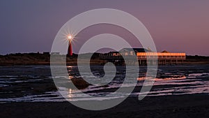 Looking towards the Schiermonnikoog lighthouse from the beach after sundown