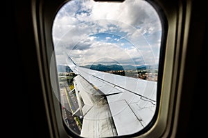 Looking trough window of an aircraft, airplane or plane wing.