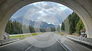 Looking through a tunnel at a mountain range in Banff Natiaonal Park in Canada