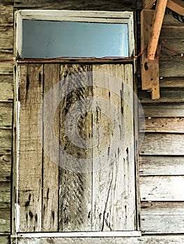 looking at the uniqueness of a room window made of wooden planks