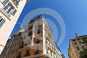 Looking up at the architectural details of an old apartment building in Toulon, France