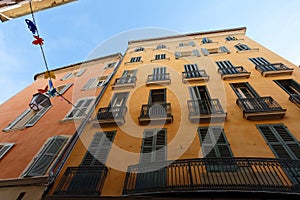 Looking up at the architectural details of an old apartment building in Toulon, France