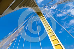 Looking up bridge in sky