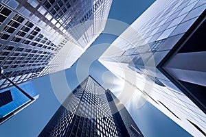 Looking up at business buildings photo