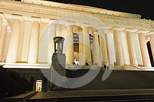 Looking up the ceremonial approach towards the illuminated Central Chamber of the Lincoln Memorial, National Mall, Washington DC