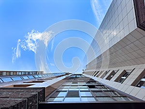 Looking Up downtown city Skyscrappers With dramatic cloudy skies. Modern building exterior photo