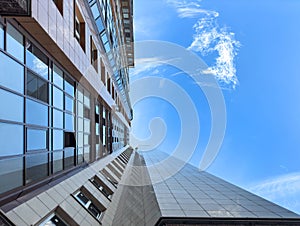 Looking Up downtown city Skyscrappers With dramatic cloudy skies. Modern building exterior photo