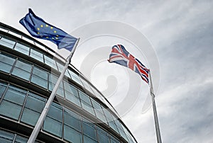 Looking up at EU and UK flags outside City Hall, London