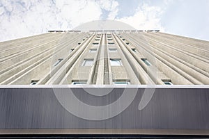 Looking up at the front of an office park and apartment