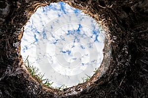 Looking up from hole in yard