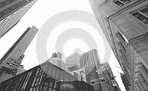 Looking up at Manhattan skyline at Fulton Street, New York City, USA