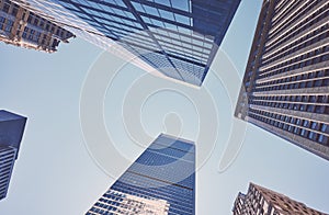 Looking up at Manhattan skyscrapers, color toned picture, New York City, USA