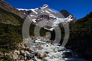 Looking up a meltwater stream towards the hanging glaciers that surround the w walk trail in Torres del Paine National Park