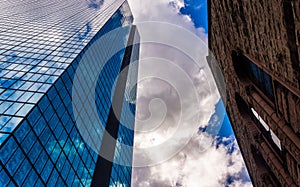 Looking up at modern buildings and cathedral in Boston, Massach