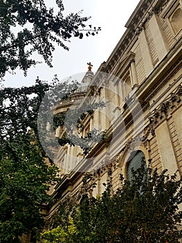 Looking up at this Oblique view of St Pauls Catheral dome surrounded with trees