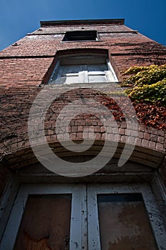 Looking up at old brick building