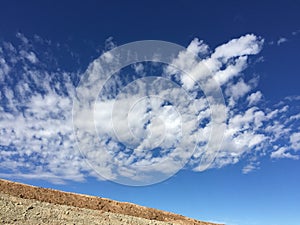 White clouds drifting in blue sky