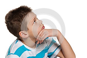 Looking up pensive boy