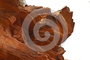 Looking up at a red sandstone ledge in the mountains of Sedona, Arizona