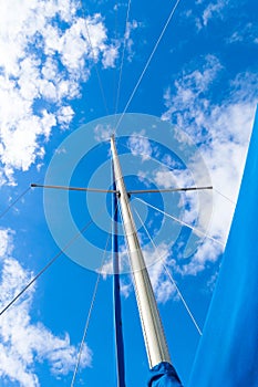 Looking up at sail boat mast and rigging. view from yacht
