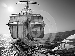 Looking up at sailors working, on traditional sailing vessel