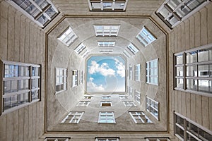 Looking up at the sky framed by a building.