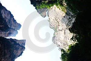 Looking up of steep stone mountain at zhangjiajie