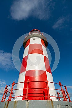 Looking up at Tall Red and White Lighthouse