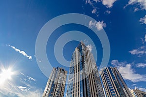 Looking up at tall residential buildings (towers)