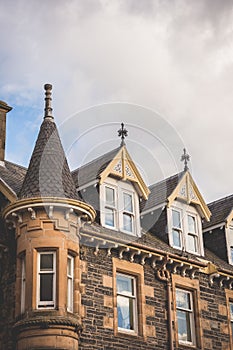 Looking up to the rooftop windows of a typical old building in t