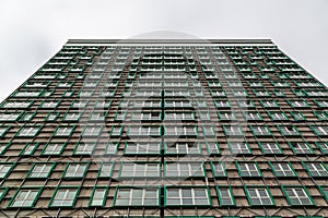 looking up at a tower block that has had its cladding removed due to being a fire hazard after the grenfell disaster, Horatia