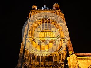 Illuminate church tower captured against the night sky