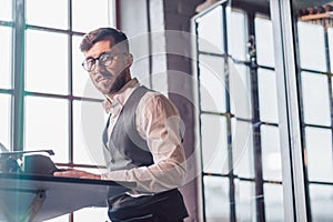 Looking young man at work