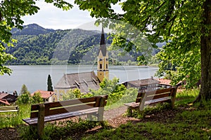 Lookout point above schliersee village with wooden benches