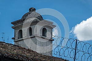 Lookout tower and barbed wire, La Antigua, Guatemala photo
